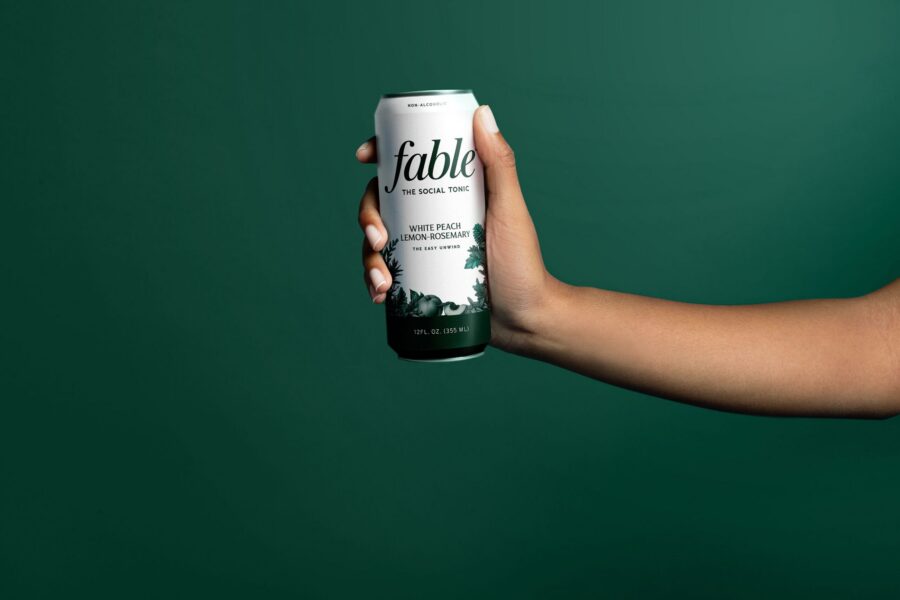 Fable social tonic white peach lemon rosemary can in hand